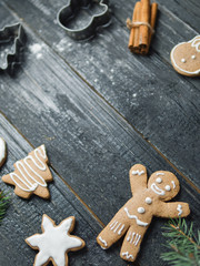 Christmas gingerbread cookies on wooden table with copy space