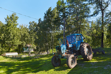 Old tractor in willage