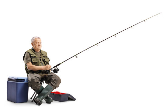 Fisherman sitting on a chair with a fishing rod