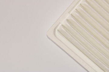 New car air filter isolated on white background . Close up. Top view