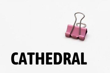 The word CATHEDRAL is displayed. image with white background. a staple is displayed.