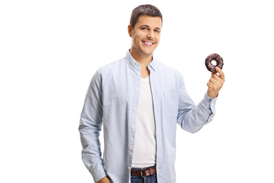 Handsome young man holding a chocolate donut