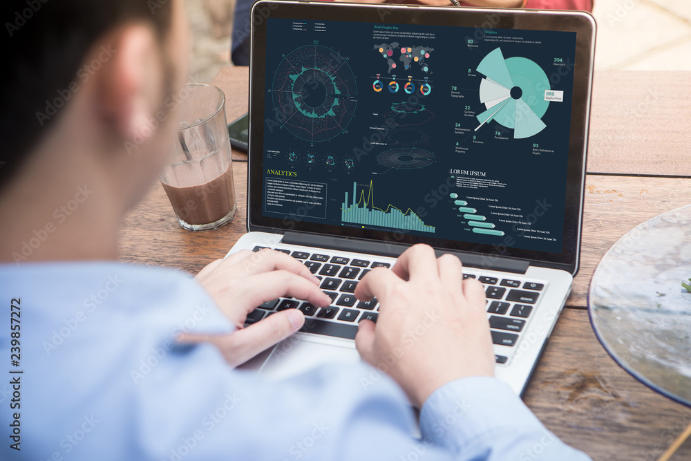 Poster back view of businessman using laptop with project statistics data, analyzing financial graphs and c