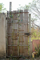 Oid bamboo gate with steel frame.