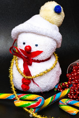 Christmas background, candy canes, snowman toy. Xmas greeting card