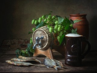 Still life with dried fish and beer
