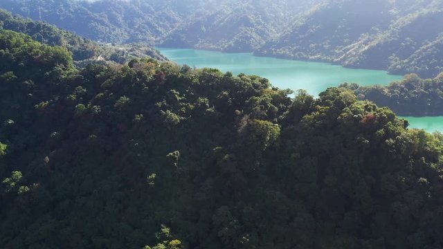 Aerial view of beautiful lake surround by mountains with mist, Shimen Reservoir, Taiwan, Asia.