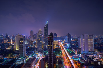 Fototapeta premium night cityscape with road to metropolis