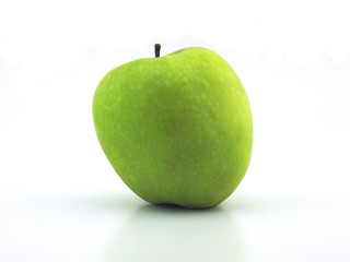 Juicy ripe green apple on a white background close-up