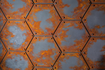 Abstract background in the form of rusted honeycombs with nuts