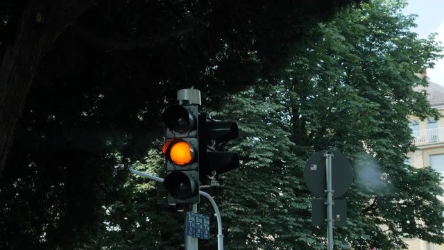 Yellow Signal Traffic Light In Daylight