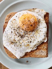 Croque Monsieur fried egg with spices on toasted sandwich