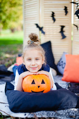 portrait of a girl on Halloween with pumpkin Jack