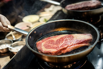 Pan sear sirloin steak cooking with chef