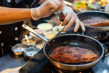 Pan sear sirloin steak cooking with chef