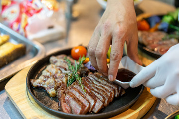sirloin steak cooking with chef.