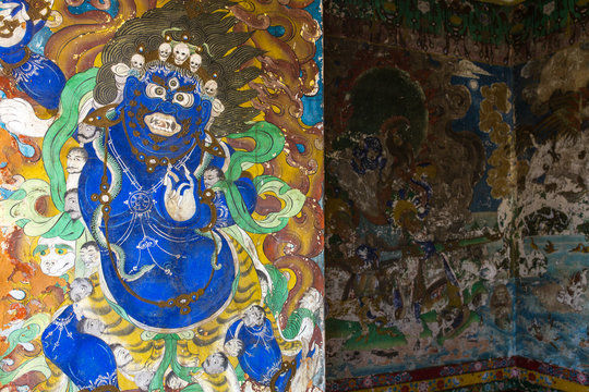 Sikkim, India - April 26, 2017: Old buddhist painting on the wall of Pemayangtsi Monastery near Pelling in the state of Sikkim, India.
