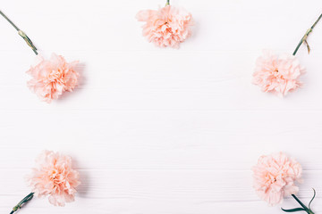 Obraz na płótnie Canvas Simple flat lay frame of pink flower buds