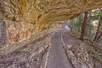Walk into History. The Sky Island Trail at Walnut Canyon National Monument leading under an overhang of sandstone. The canyon is managed by the National Park Service. No property release is needed.