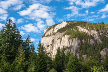 Mountain Cliff under Blue Sky with Clouds on a Summer Day. Squamish, BC, Canada.