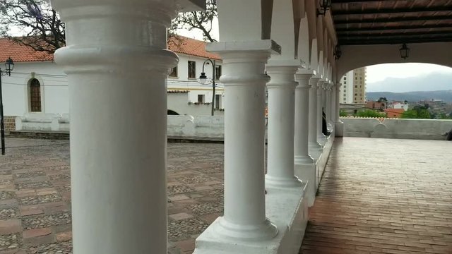 SUCRE, BOLIVIA, DEC 2018: Cityscape of Sucre, Bolivia Anzares square plaza with a historic fountain