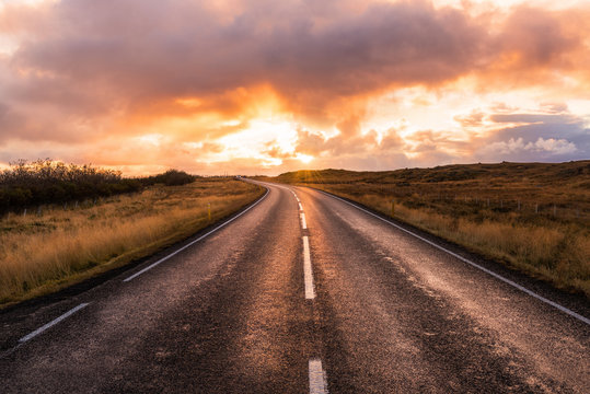 Majestic Orange Sunset Over Country Road In Iceland In Autumn