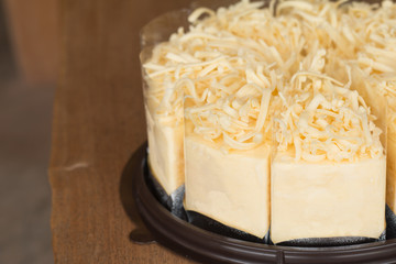 Close up of Cheese cake on wooden desk background