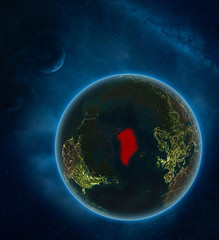 Greenland at night from space with Moon and Milky Way. Detailed planet Earth with city lights and visible country borders.