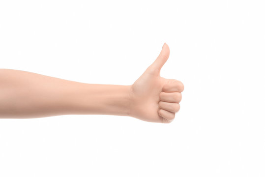 partial view of woman showing thumb up sign isolated on white