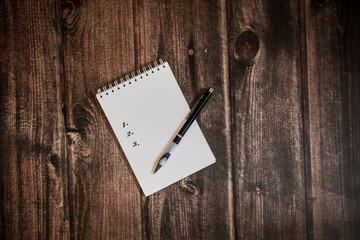 list in notebook, shoping list, to do list, goals list, wish list, idea list, pen for writting
