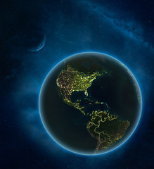Jamaica at night from space with Moon and Milky Way. Detailed planet Earth with city lights and visible country borders.