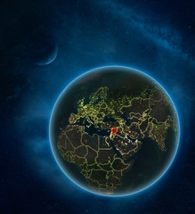 Syria at night from space with Moon and Milky Way. Detailed planet Earth with city lights and visible country borders.