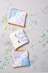 Unicorn or mermaid toasts with stars, food for kids idea, top view