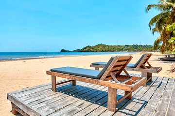 beach lounger under coconut trees, madagascar