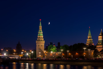 Fototapeta premium Night view of moscow kremlin with moon in the sky
