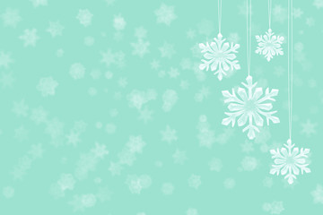 New Year's background. Ice snowflakes hang on threads.