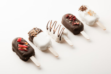 Different variants of cake popsice creams arranged diagonally