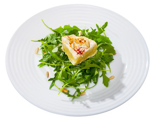 Camembert on arugula with pine nuts