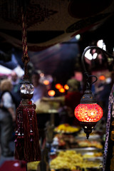 Fototapeta na wymiar beautiful multicolored arabic lamps glowing at night in a market 