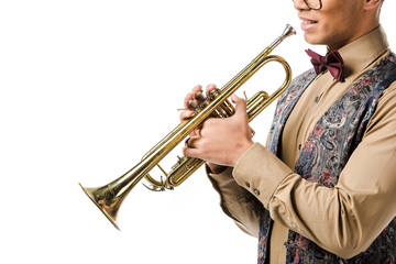 Obraz na płótnie Canvas partial view of young male jazzman posing with trumpet isolated on white