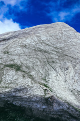 Hikers reaching mountain top, hiking uphill. Bulgaria, Vihren mountain.