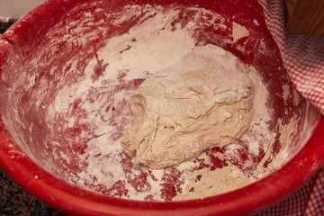 Photograph of how homemade bread is made in a wood-burning oven.