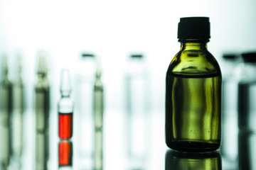 Group of ampoules with a transparent medicine in medical laboratory