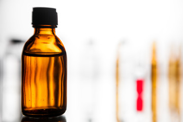 Group of ampoules with a transparent medicine in medical laboratory
