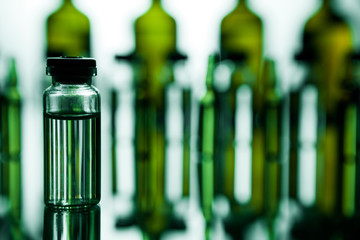 Group of ampoules with a transparent medicine in medical laboratory