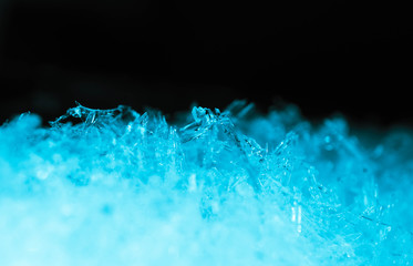 Abstract ice crystal structure texture, macro view. Cold concept, blue and black colors.