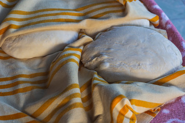 Photograph of how homemade bread is made in a wood-burning oven.