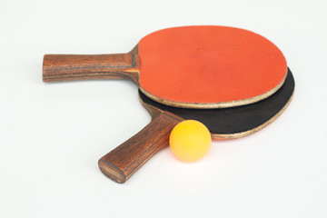 Table tennis racket with orange ball