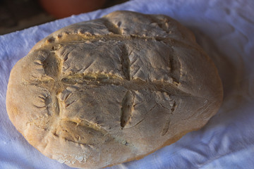 Photograph of how homemade bread is made in a wood-burning oven.