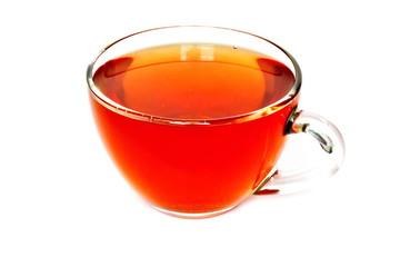 Glass cup of golden tea on white background. Isolated